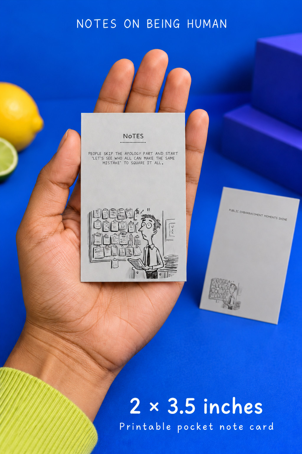 Square It All 2 × 3.5-inch printable pocket note card shown in an adult hand for scale, with grey artwork against a cobalt blue and violet backdrop